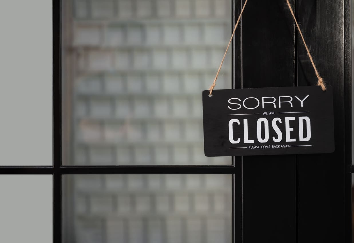 sign saying "Sorry closed" on a closed door