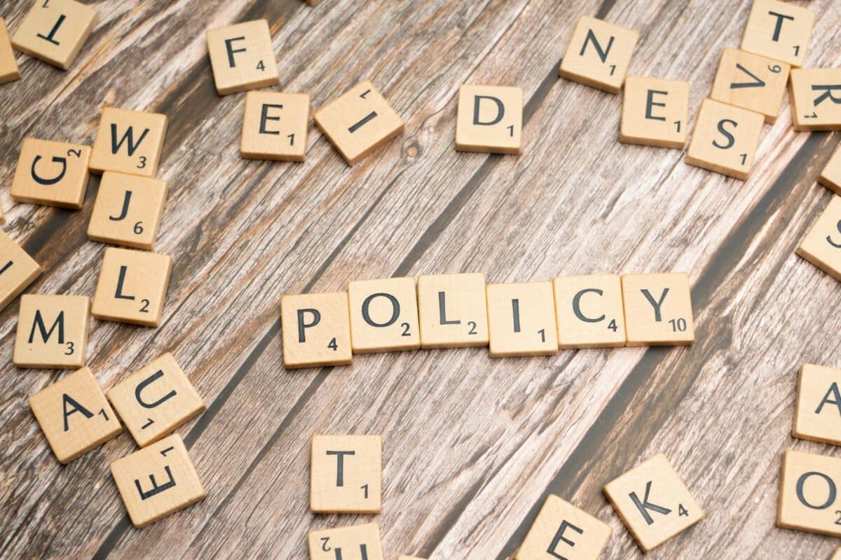Scrabble tiles spelling out the word "policy"