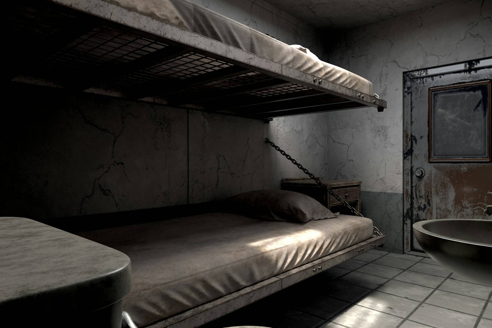 Empty bunk beds in a dark prison cell